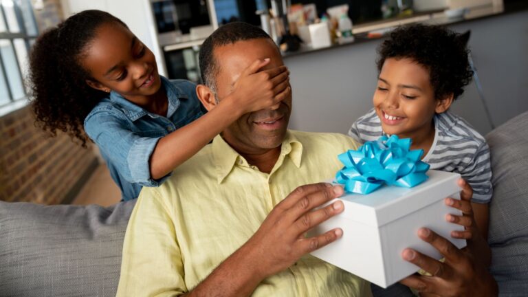 kids giving Dad gift on Father's Day